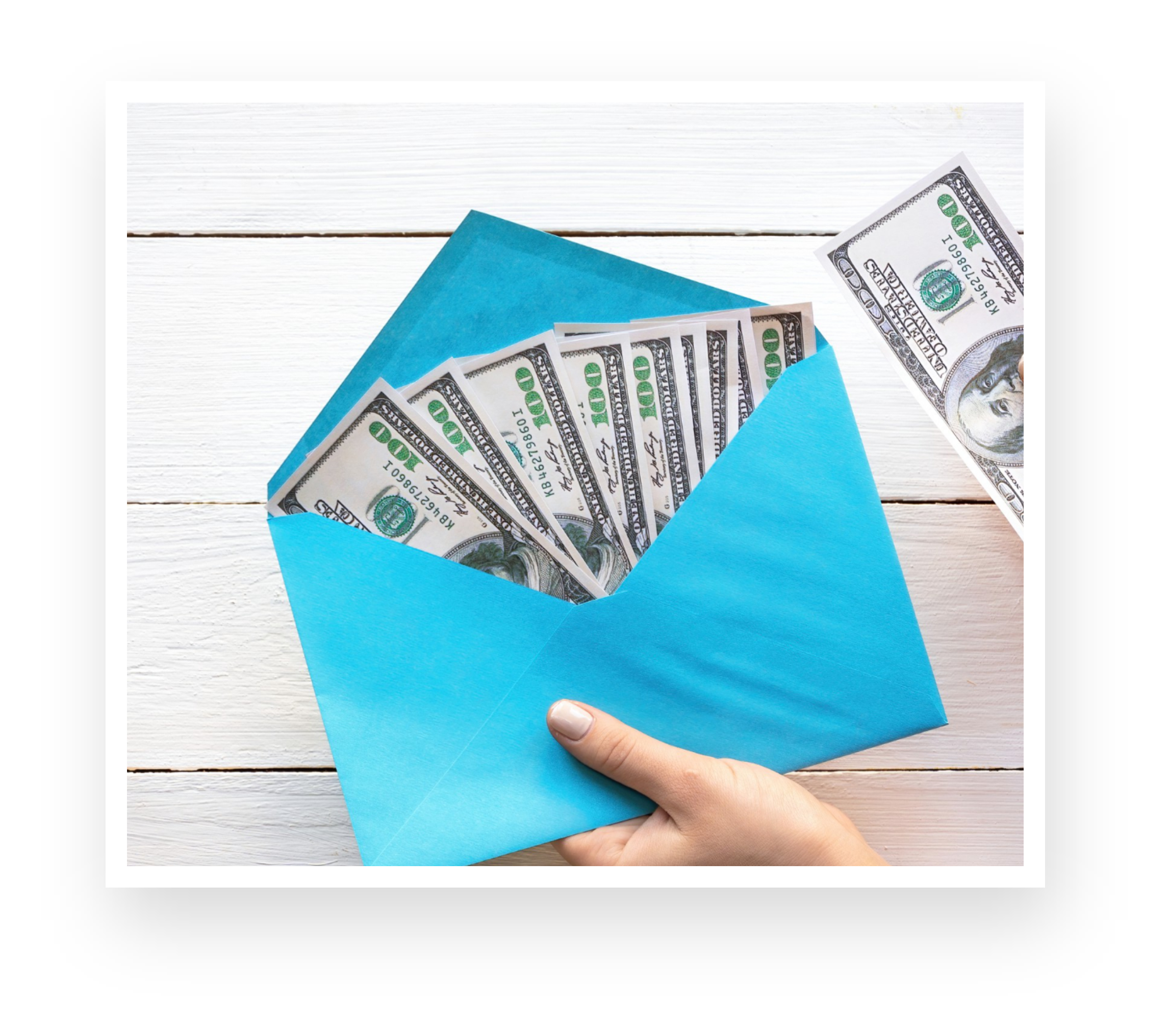 female-hands-holding-envelope-with-money-wooden-background-finance-idea