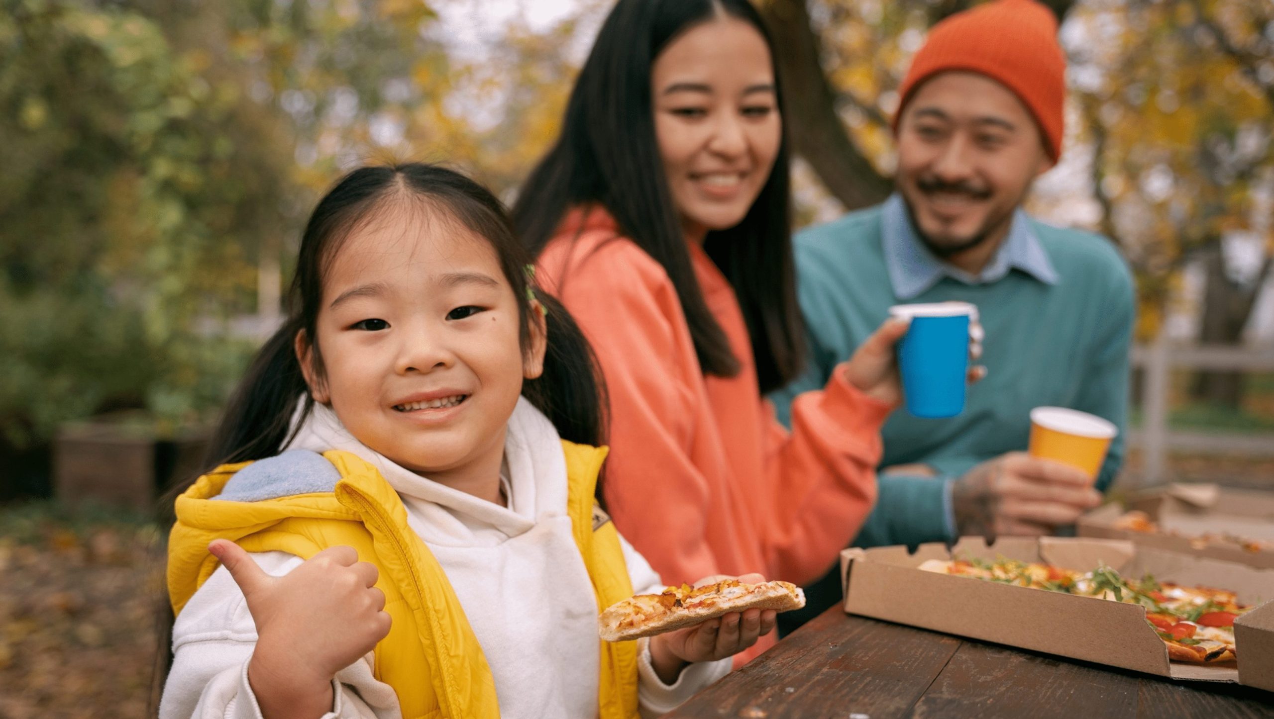 https://cityofrefugecolumbia.org/wp-content/uploads/2023/04/parents-kid-eating-pizza-outdoors-side-view-scaled-e1681211245397.jpg