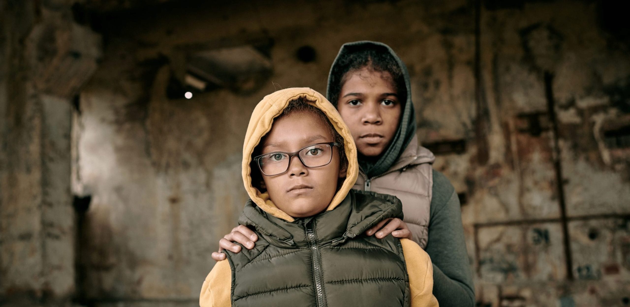 https://cityofrefugecolumbia.org/wp-content/uploads/2023/04/portrait-two-sisters-hoodies-standing-inside-abandoned-house-they-left-alone-after-hostilities-scaled-e1681212073858.jpg